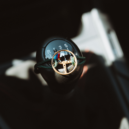 Classic Steering Wheel Bracelet attached to a gear shifter.