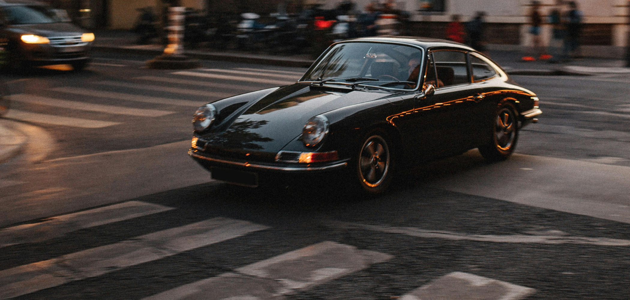 Porsche is driving through the city.